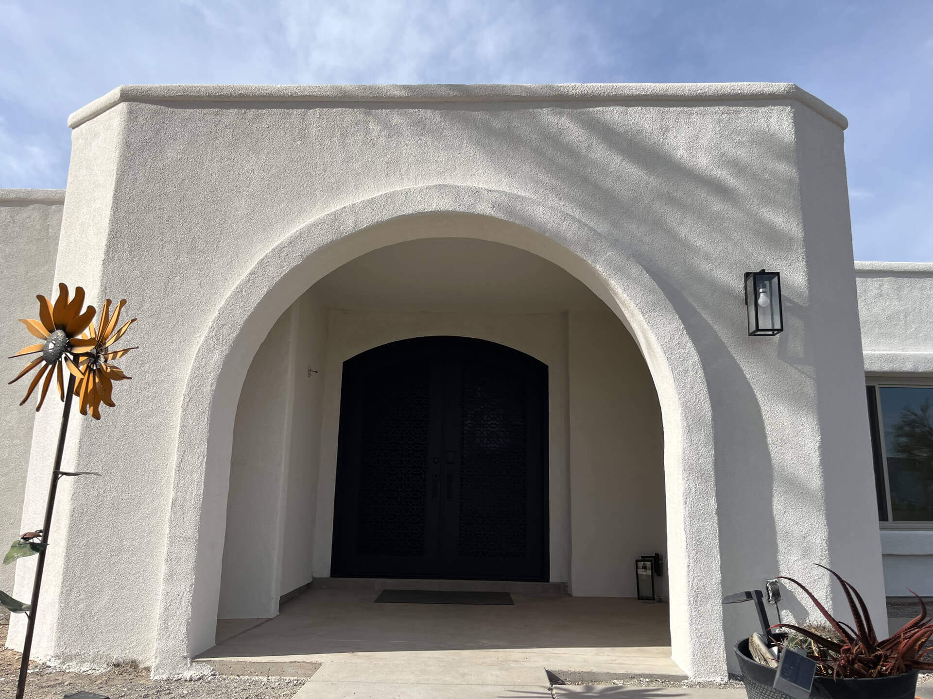 Finished premium stucco home entry by Sunset Coatings